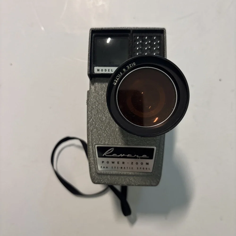 The Revere Model 118D Eye Matic 8mm Movie Camera Power Zoom Telephoto Wide Angle